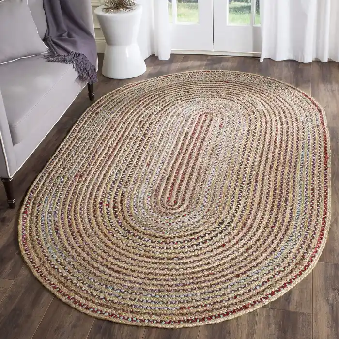 Round jute rug in a boho-style bedroom with earthy tones.