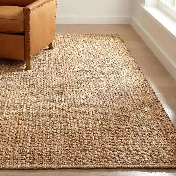 Natural-jute-rug-with-a-blue-and-beige-color-pattern-in-a-living-room
